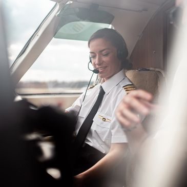 Commercial pilot in uniform flying an aircraft